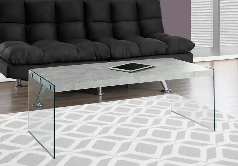 44 Table basse moderne – Gris ciment avec pieds en verre